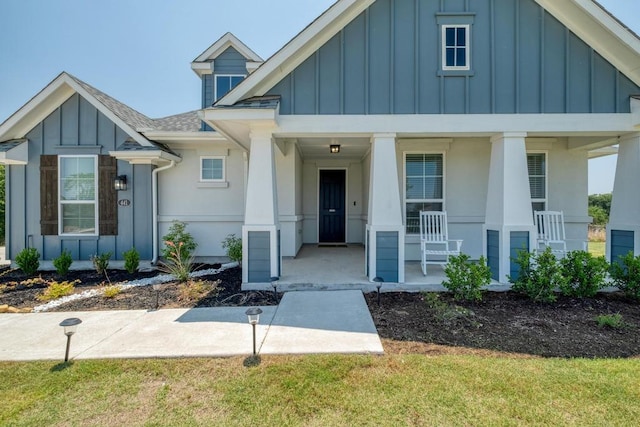 441 Double Eagle Ranch Dr, Cedar Creek, TX 78612 - view of front of home featuring board and batten siding, covered porch, and a shingled roof