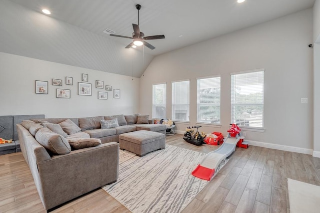 441 Double Eagle Ranch Dr, Cedar Creek, TX 78612 - living area with ceiling fan, lofted ceiling, wood finished floors, baseboards, and recessed lighting