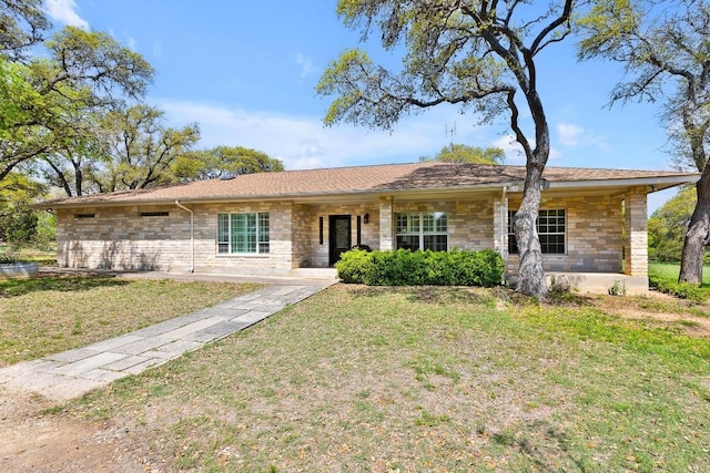 297 Carpers Trl, Fischer, TX 78623 - ranch-style house featuring stone siding and a front lawn
