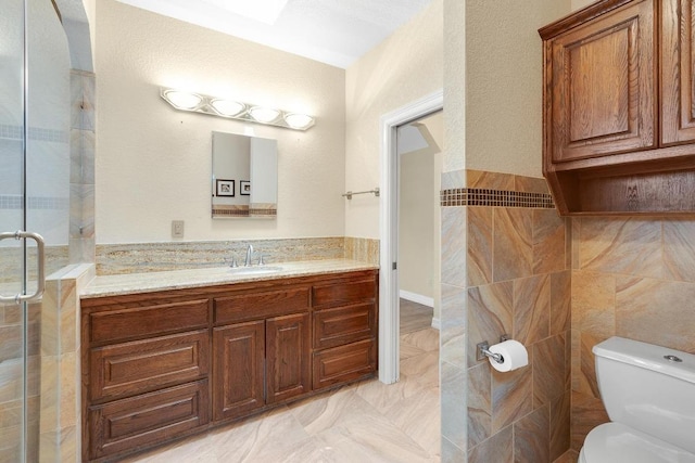 297 Carpers Trl, Fischer, TX 78623 - full bath featuring toilet, vanity, tile walls, and a shower stall