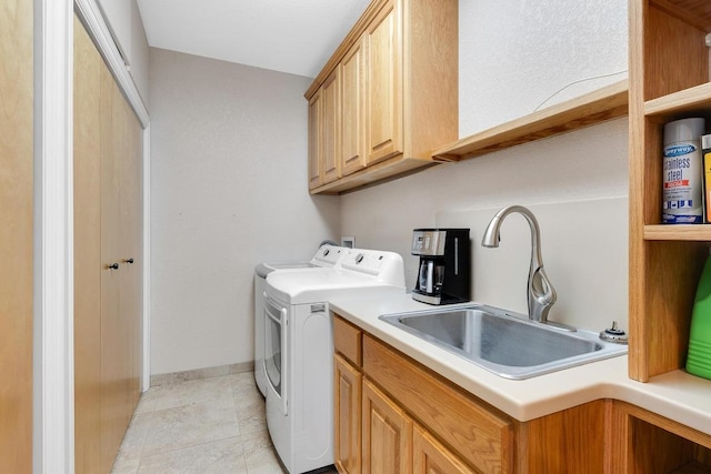 297 Carpers Trl, Fischer, TX 78623 - washroom featuring a sink, washing machine and clothes dryer, and baseboards