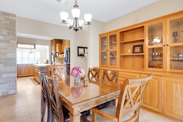 297 Carpers Trl, Fischer, TX 78623 - dining area featuring a chandelier and light tile patterned floors