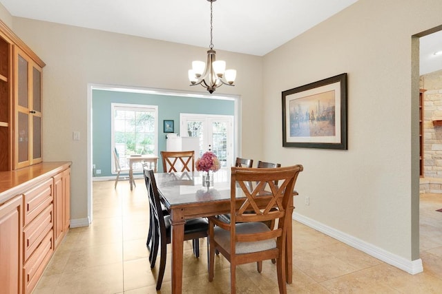 297 Carpers Trl, Fischer, TX 78623 - dining room with light tile patterned flooring, a chandelier, french doors, and baseboards
