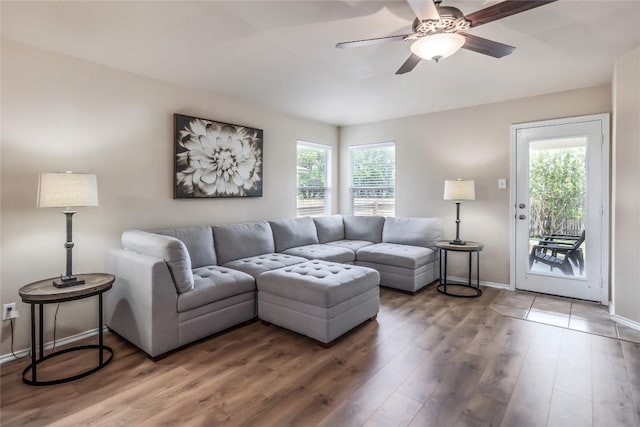 217 Baldwin St, Hutto, TX 78634 - living room featuring a ceiling fan, wood finished floors, and baseboards