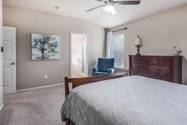 217 Baldwin St, Hutto, TX 78634 - bedroom featuring light colored carpet, lofted ceiling, baseboards, ensuite bath, and ceiling fan