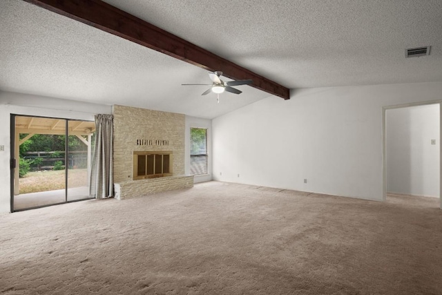 7104 Greenock St, Austin, TX 78749 - unfurnished living room with a ceiling fan, a textured ceiling, carpet flooring, and a fireplace