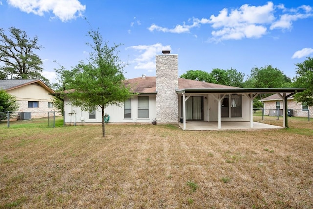 7104 Greenock St, Austin, TX 78749 - rear view of property featuring a patio, a chimney, and central air condition unit