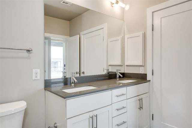 2724 Treble Ln Unit 324, Austin, TX 78704 - bathroom featuring double vanity and toilet