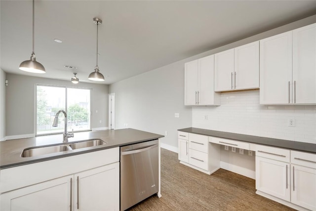 2724 Treble Ln Unit 324, Austin, TX 78704 - kitchen featuring dishwasher, a sink, dark countertops, decorative light fixtures, and decorative backsplash