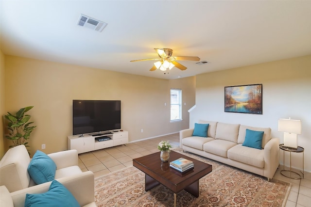 1214 Hensley Dr, Leander, TX 78641 - living room with light tile patterned flooring, ceiling fan, and baseboards