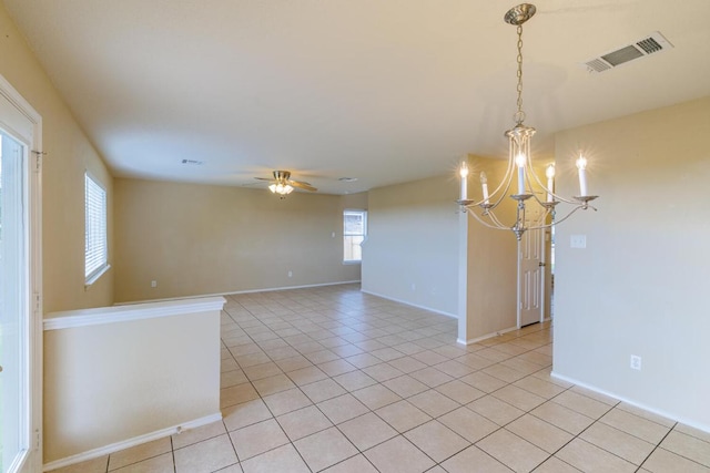 1214 Hensley Dr, Leander, TX 78641 - unfurnished room featuring a chandelier, light tile patterned floors, a ceiling fan, and baseboards