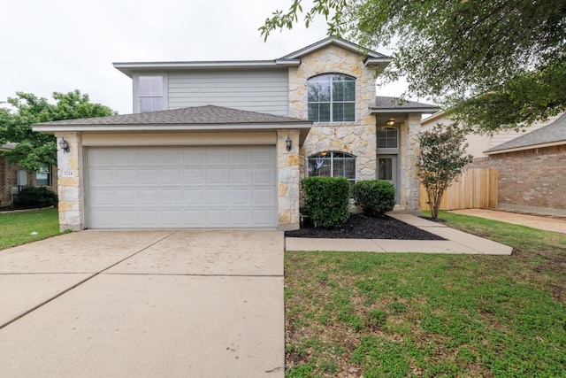 1214 Hensley Dr, Leander, TX 78641 - view of front facade featuring stone siding, driveway, and a garage