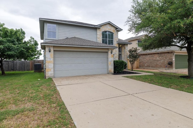 1214 Hensley Dr, Leander, TX 78641 - view of front of property with central AC unit, an attached garage, concrete driveway, and stone siding