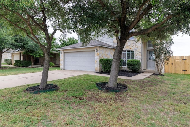 1214 Hensley Dr, Leander, TX 78641 - obstructed view of property featuring stone siding, concrete driveway, and a garage