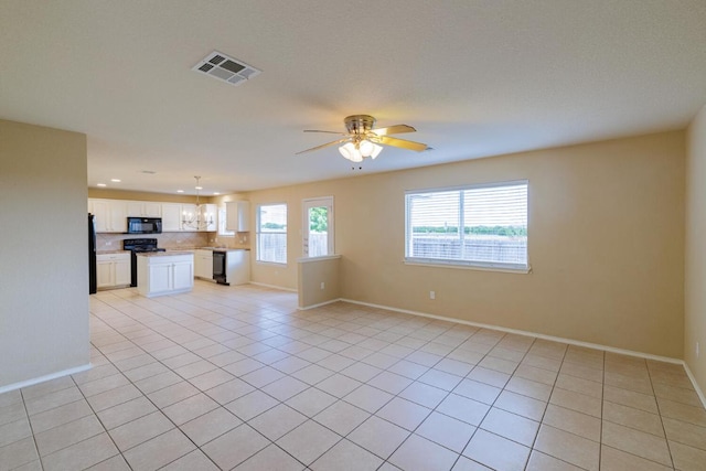 1214 Hensley Dr, Leander, TX 78641 - unfurnished living room with light tile patterned floors, baseboards, a ceiling fan, and recessed lighting