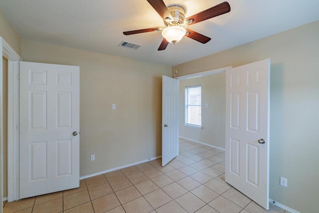 1214 Hensley Dr, Leander, TX 78641 - unfurnished room with a ceiling fan, light tile patterned floors, and baseboards