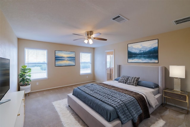 1214 Hensley Dr, Leander, TX 78641 - carpeted bedroom with baseboards and a ceiling fan