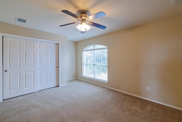 1214 Hensley Dr, Leander, TX 78641 - unfurnished bedroom with carpet, a closet, baseboards, and ceiling fan