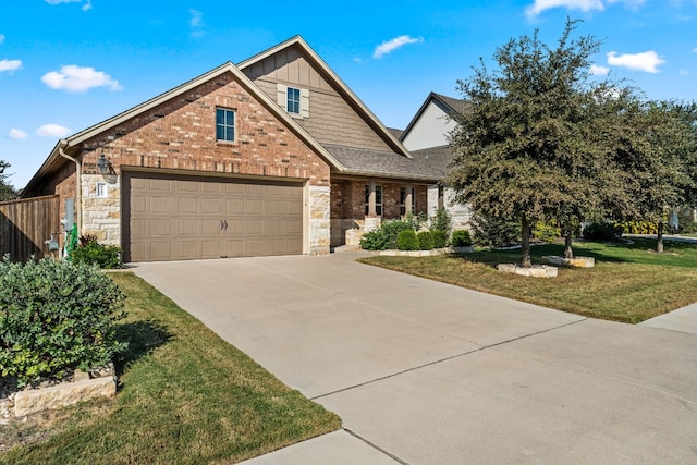 4162 Kingsley Ave, Round Rock, TX 78681 - view of front of home with concrete driveway, a garage, board and batten siding, brick siding, and stone siding