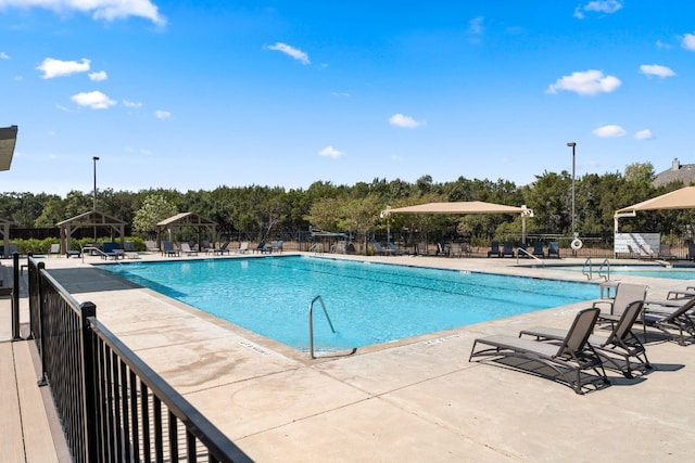 4162 Kingsley Ave, Round Rock, TX 78681 - community pool featuring a gazebo, view of scattered trees, and a patio area