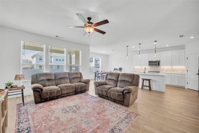 240 Harbors Ln, Leander, TX 78641 - living area featuring ceiling fan, light wood-type flooring, and recessed lighting