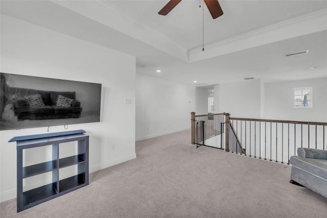 240 Harbors Ln, Leander, TX 78641 - living area with carpet flooring, an upstairs landing, crown molding, ceiling fan, and baseboards