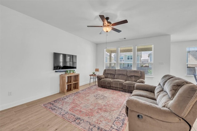 240 Harbors Ln, Leander, TX 78641 - living room with a ceiling fan, wood finished floors, and baseboards