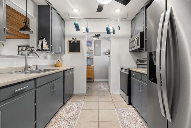 110 N Willis St, Lampasas, TX 76550 - kitchen featuring stainless steel appliances, ceiling fan, gray cabinetry, light countertops, and light tile patterned flooring