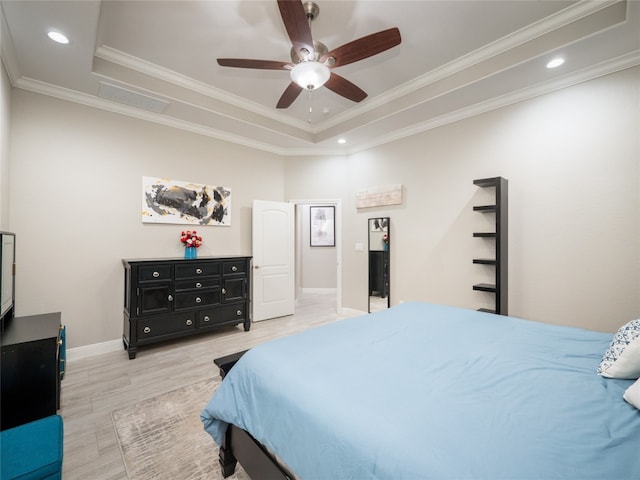 128 Naalehu Ct, Bastrop, TX 78602 - bedroom featuring a tray ceiling, light wood-style flooring, baseboards, ornamental molding, and recessed lighting
