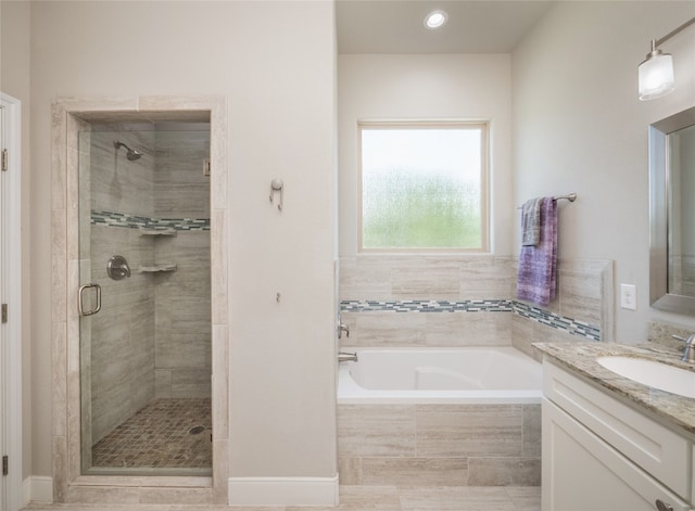 128 Naalehu Ct, Bastrop, TX 78602 - full bath featuring vanity, a shower stall, and a bath