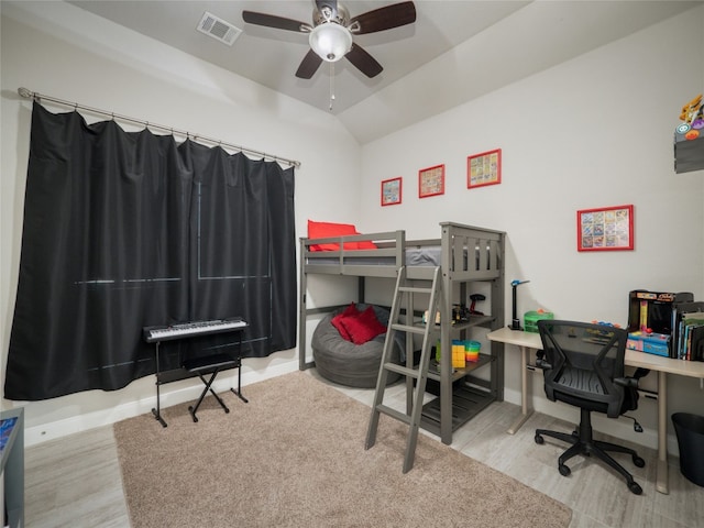 128 Naalehu Ct, Bastrop, TX 78602 - bedroom featuring wood finished floors, lofted ceiling, a desk, baseboards, and ceiling fan