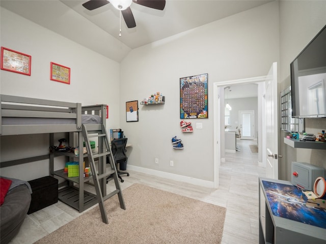 128 Naalehu Ct, Bastrop, TX 78602 - bedroom with lofted ceiling, an office area, baseboards, ceiling fan, and light wood finished floors