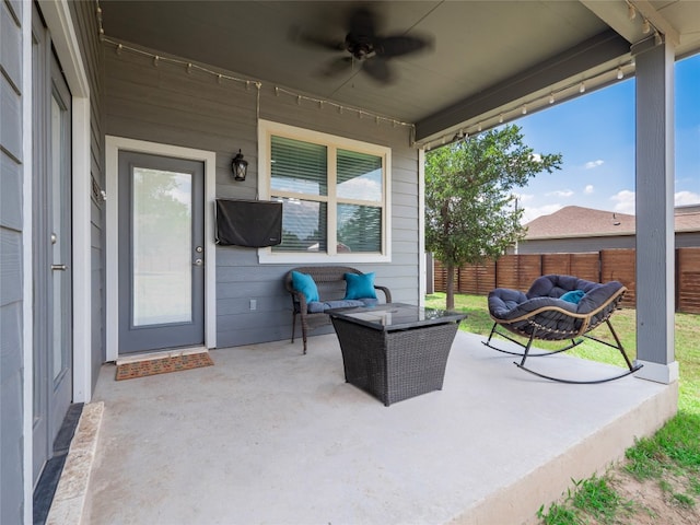 128 Naalehu Ct, Bastrop, TX 78602 - fenced backyard featuring outdoor lounge area, ceiling fan, and a patio