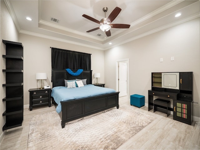 128 Naalehu Ct, Bastrop, TX 78602 - bedroom with a raised ceiling, baseboards, light wood finished floors, ornamental molding, and a ceiling fan