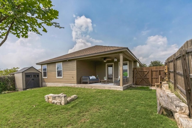 217 Hoya Ln, San Marcos, TX 78666 - rear view of property with a storage shed, a patio, a fenced backyard, a ceiling fan, and outdoor lounge area