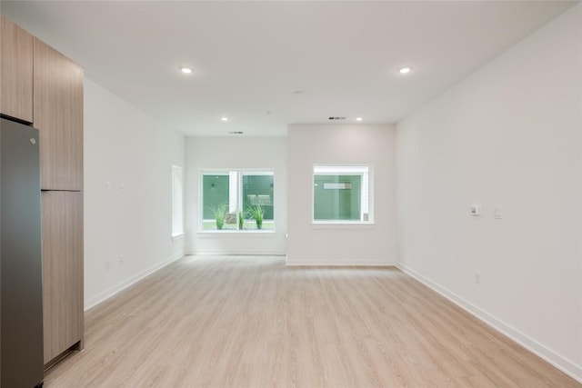 4802 S Congress Ave Unit 121, Austin, TX 78745 - empty room featuring light wood-style floors and recessed lighting