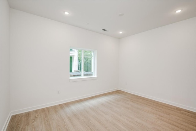 4802 S Congress Ave Unit 121, Austin, TX 78745 - unfurnished room with light wood finished floors and recessed lighting