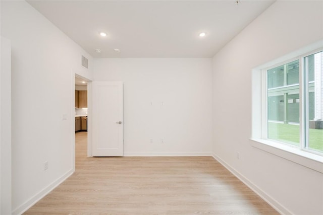 4802 S Congress Ave Unit 121, Austin, TX 78745 - spare room featuring light wood-style flooring and recessed lighting