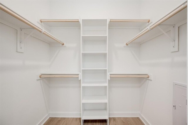 4802 S Congress Ave Unit 121, Austin, TX 78745 - walk in closet with light wood-style floors