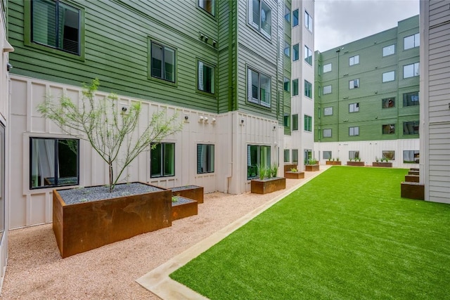 4802 S Congress Ave Unit 121, Austin, TX 78745 - rear view of house featuring a lawn