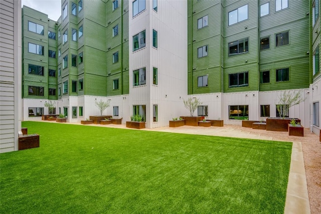 4802 S Congress Ave Unit 121, Austin, TX 78745 - view of home's community with a yard