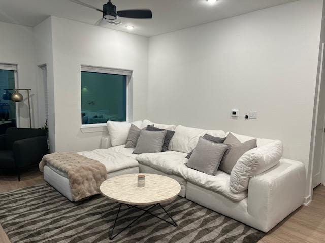 4802 S Congress Ave Unit 121, Austin, TX 78745 - living area with light wood-style flooring and a ceiling fan