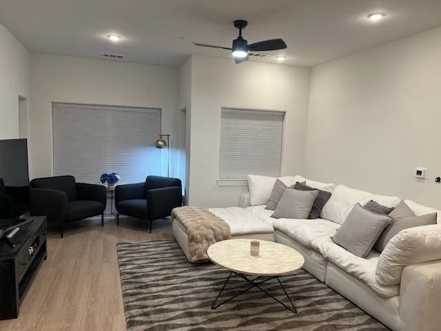 4802 S Congress Ave Unit 121, Austin, TX 78745 - living area featuring wood finished floors and ceiling fan