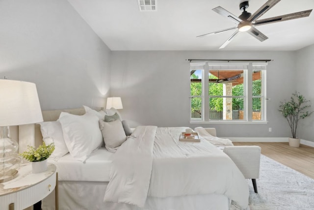 7820 Oteka Cv, Austin, TX 78735 - bedroom with wood finished floors, a ceiling fan, and baseboards