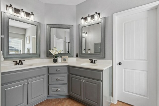 7820 Oteka Cv, Austin, TX 78735 - full bathroom with double vanity and tile patterned flooring