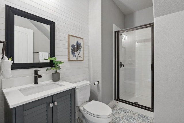 7820 Oteka Cv, Austin, TX 78735 - bathroom with a shower stall, vanity, and tile patterned floors