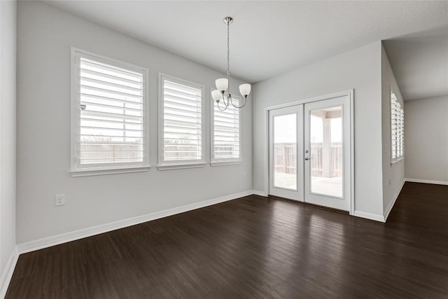 825 Fortrose Ter, Pflugerville, TX 78660 - unfurnished dining area with french doors, healthy amount of natural light, dark wood-type flooring, and a chandelier