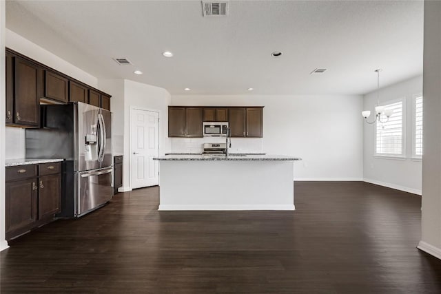825 Fortrose Ter, Pflugerville, TX 78660 - kitchen featuring stainless steel appliances, dark brown cabinetry, dark wood-style floors, recessed lighting, and baseboards