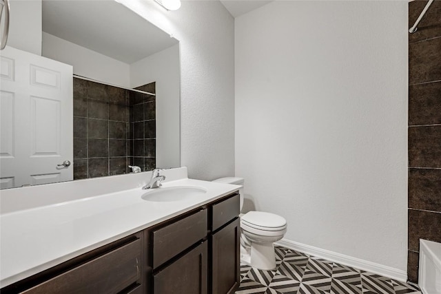 825 Fortrose Ter, Pflugerville, TX 78660 - bathroom featuring toilet, vanity, tiled shower, tile patterned floors, and baseboards