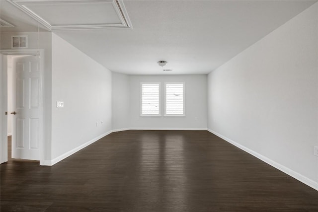 825 Fortrose Ter, Pflugerville, TX 78660 - spare room featuring dark wood-style floors, baseboards, and attic access